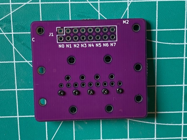 nozzle PCB on connector PCB with a single row of screws